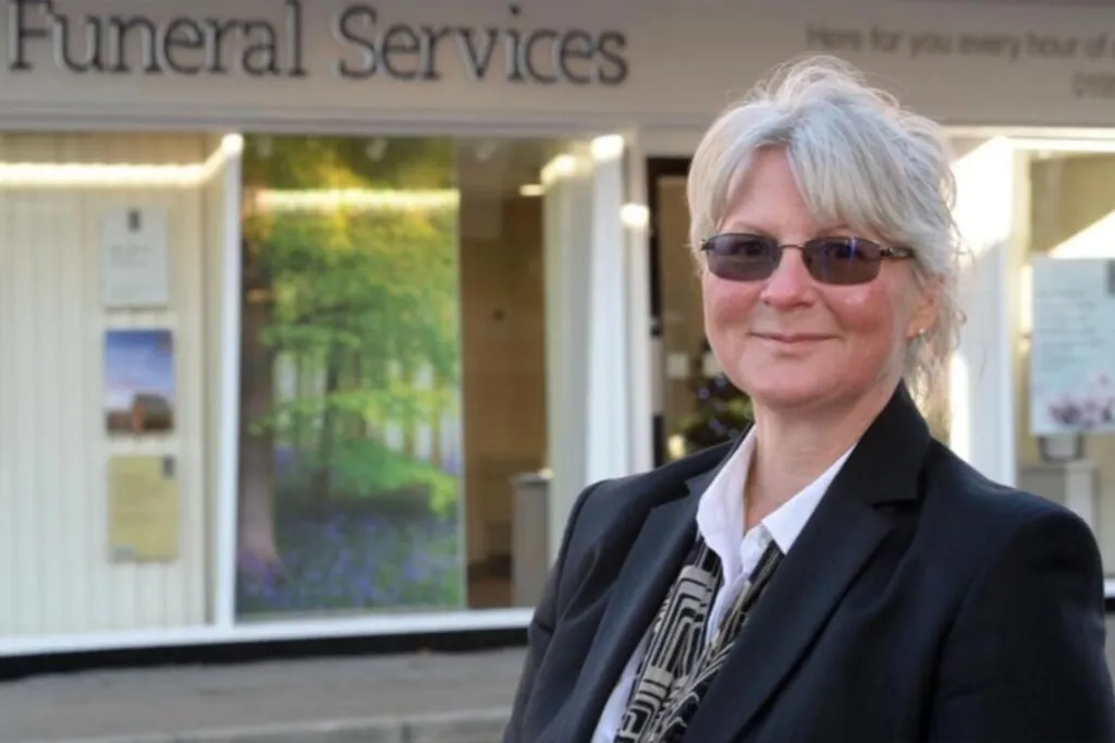 Sally Blundell, a funeral worker, standing outside 
