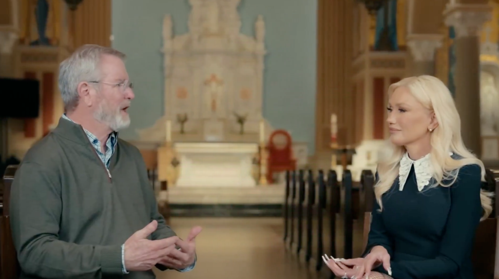 Gwen Stefani and a man talk in a church.
