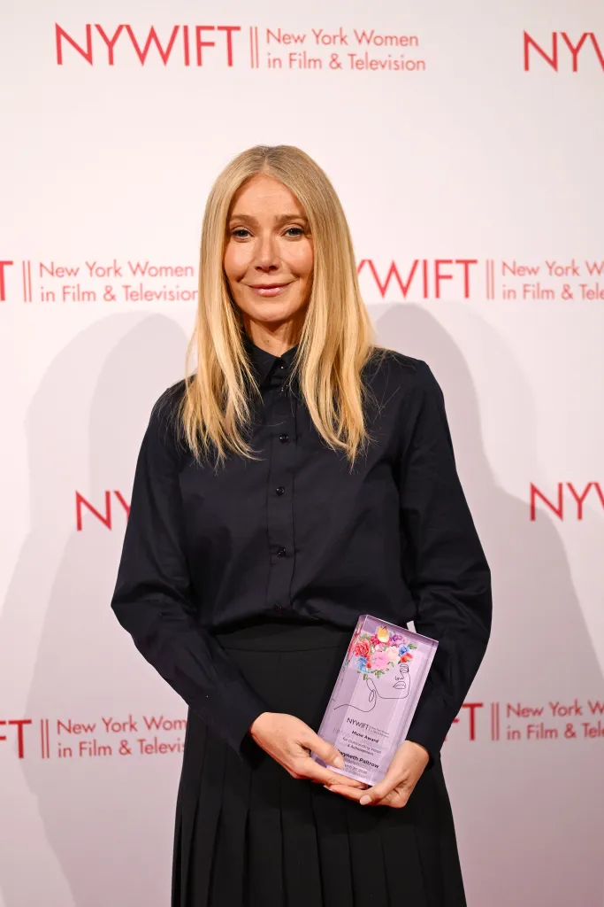 Gwyneth Paltrow holding her Muse Award at the 46th Annual Muse Awards.