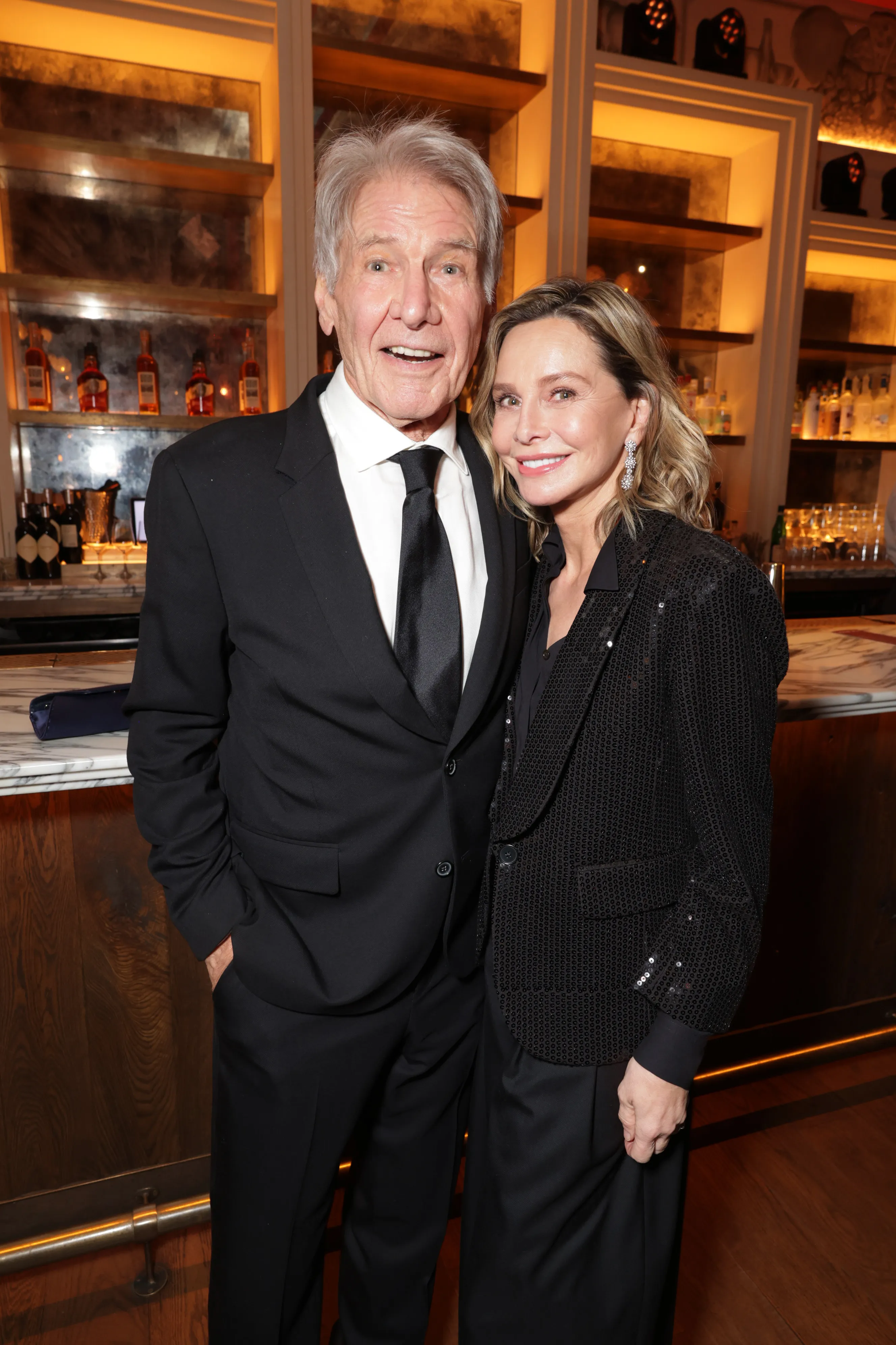 Harrison Ford and Calista Flockhart smile at the Apple TV+ Emmy Awards Post Ceremony Reception.