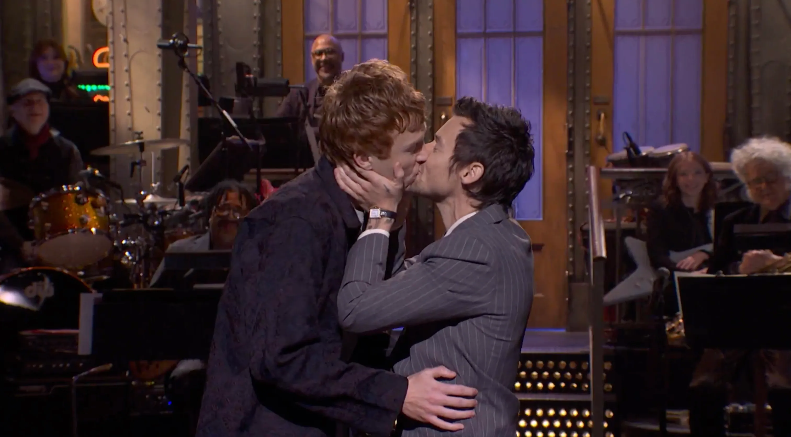 Harry Styles kissing comedian Ben Marshall on Saturday Night Live.