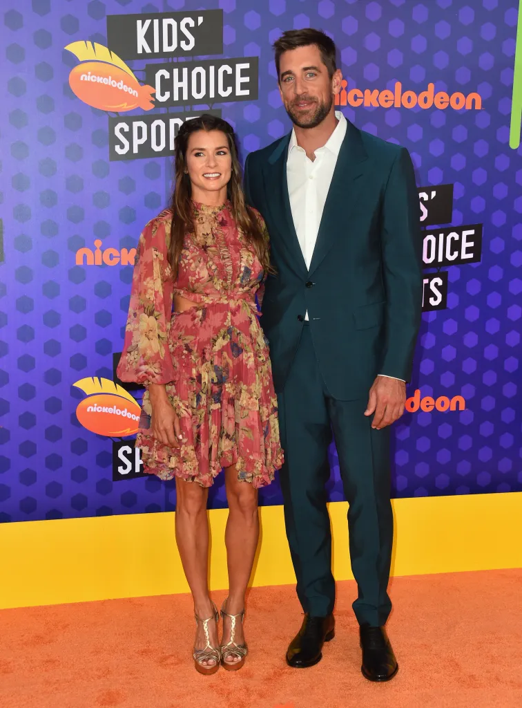 Danica Patrick and Aaron Rodgers on the red carpet at the Nickelodeon Kids' Choice Sports event.