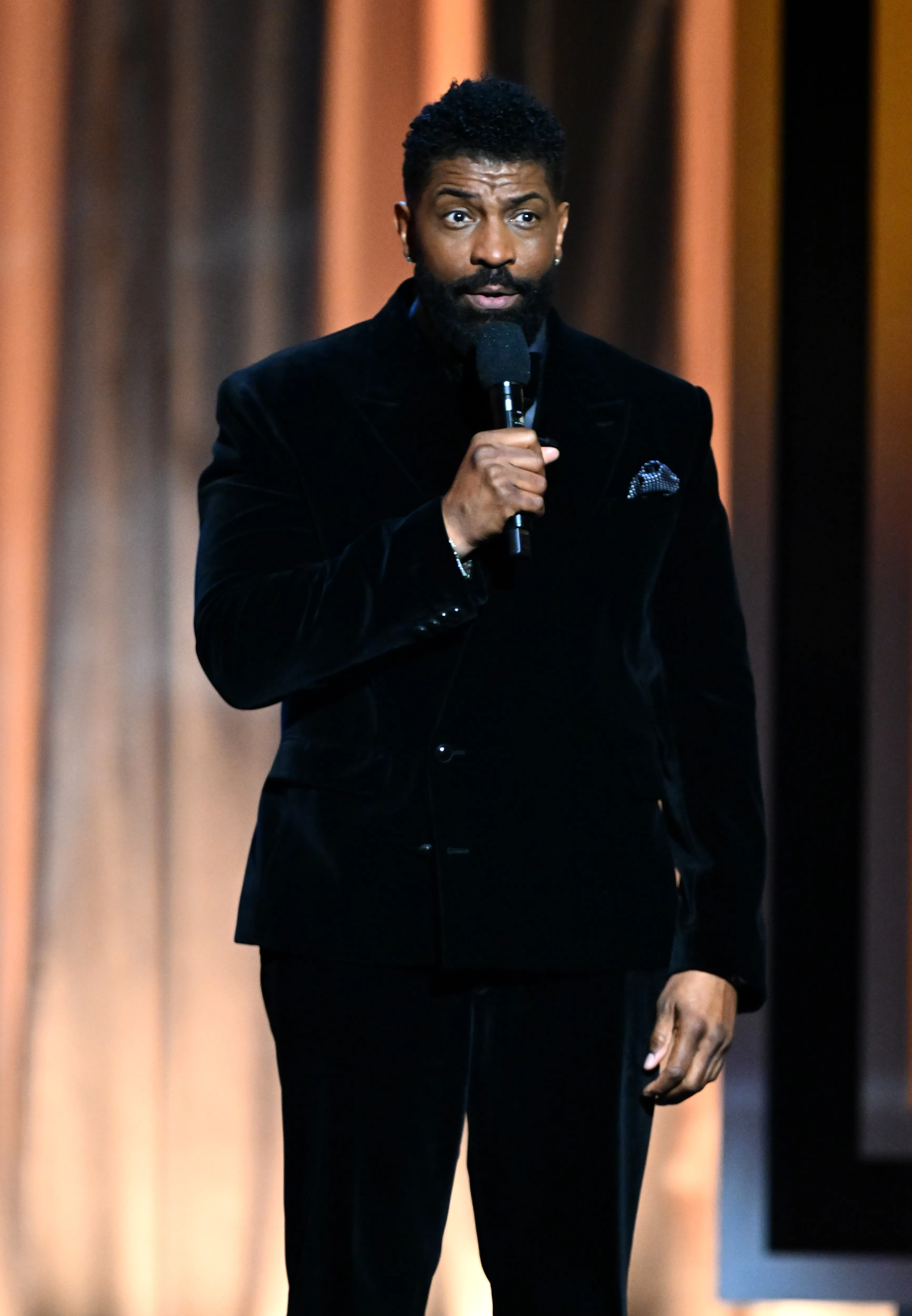 Deon Cole speaking onstage during the 57th NAACP Image Awards.