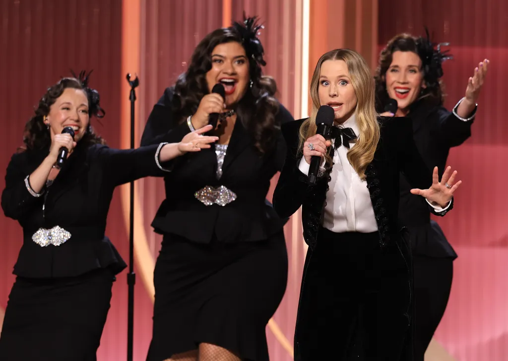 Host Kristen Bell performing onstage with three other women at the 32nd Annual Actor Awards.