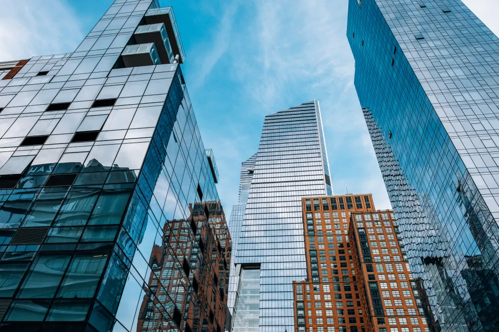 Looking up view of multiple skyscrapers at Hudson Yards in Midtown Manhattan, New York City.