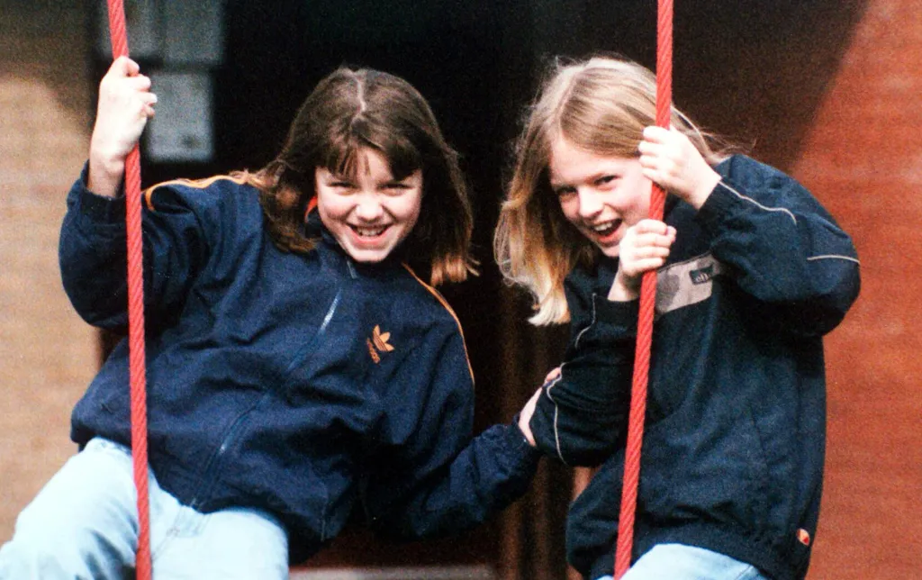 Holly Wells and Jessica Chapman smiling on a swing.