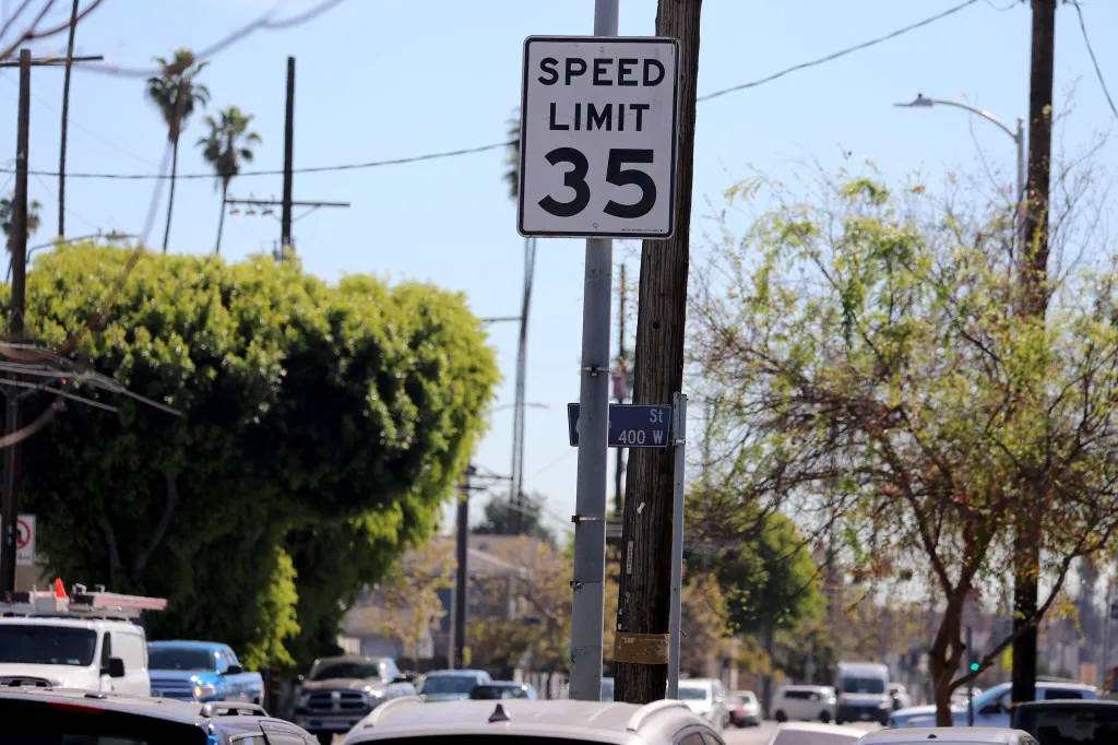 A street sign indicating a speed limit of 35 mph at the intersection of S. Figueroa Street and Gage Avenue.