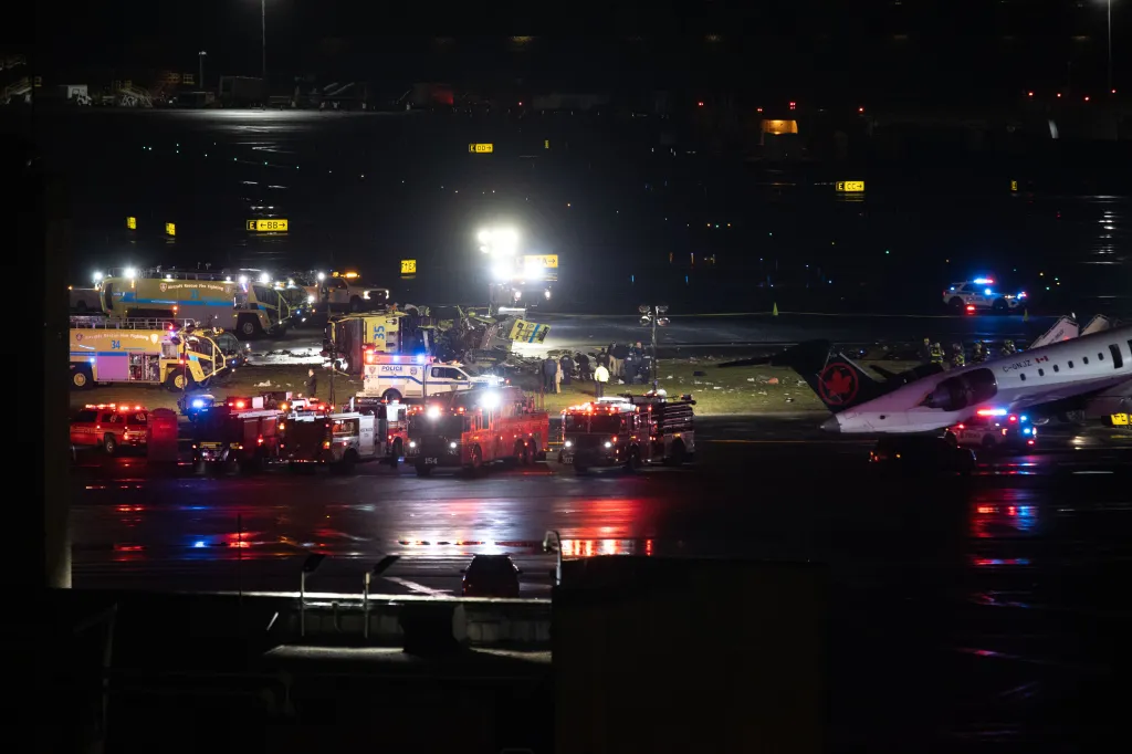 Emergency services at the scene of an Air Canada airplane crash with a Port Authority crash truck at La Guardia Airport.