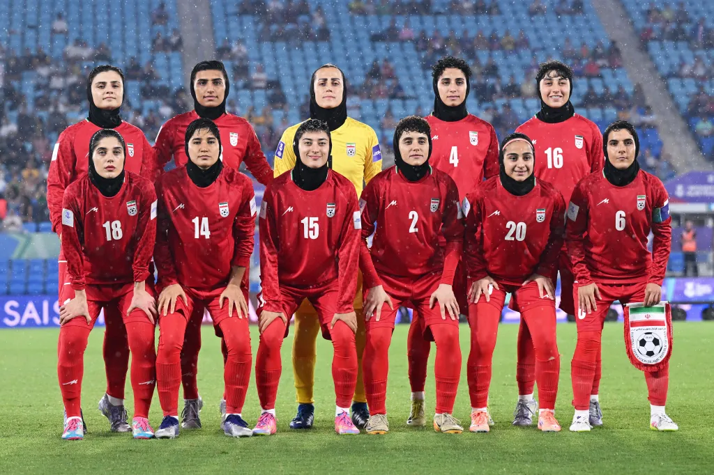 Iran players pose for a team photo ahead of the Women's Asian Cup soccer match.