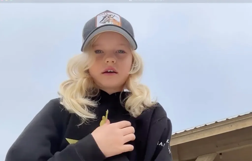 James Van Der Beek's daughter, Olivia, wearing a baseball cap and black hoodie, remembering the late actor Luke Perry.