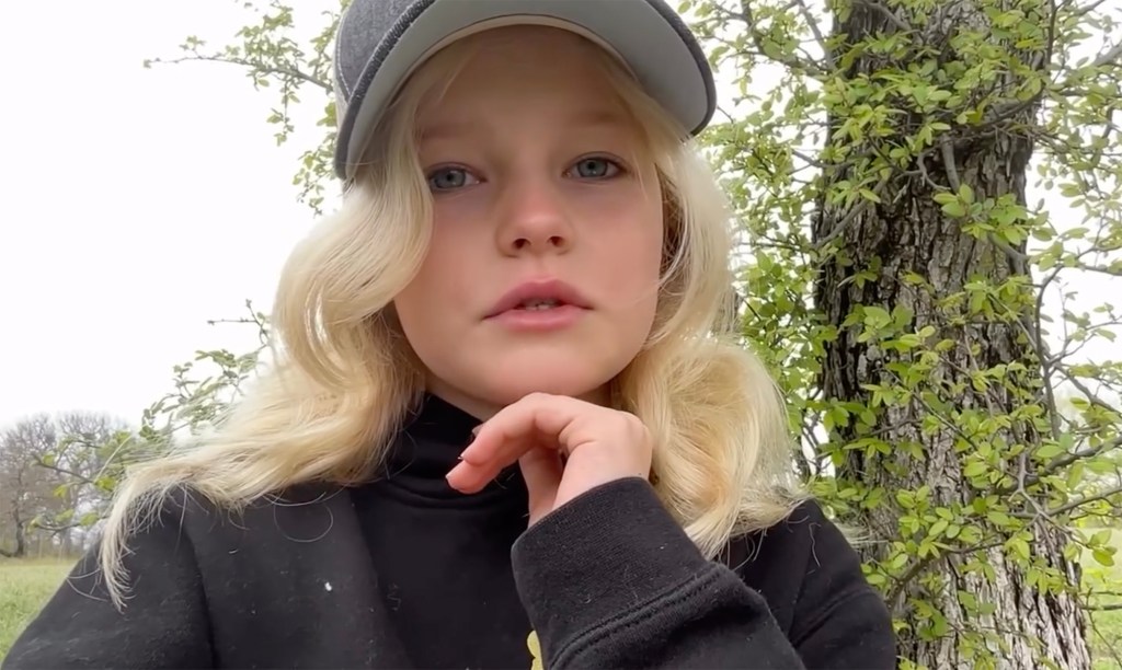 James Van Der Beek's daughter, Olivia Van Der Beek, with blonde hair and a baseball cap.