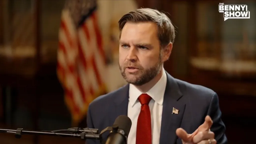 JD Vance speaking into a microphone.
