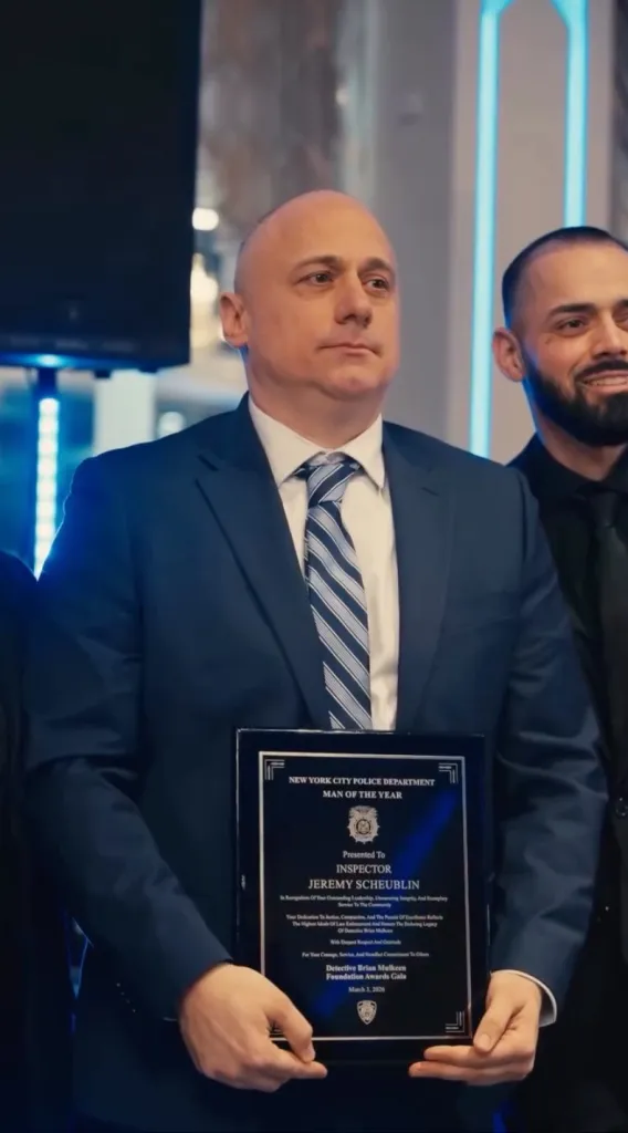Jeremy Scheublin receiving the New York City Police Department Man of the Year award.