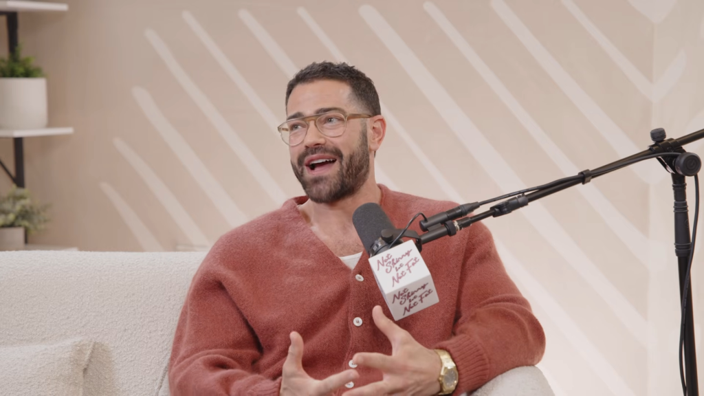Jesse Metcalfe speaking into a microphone.
