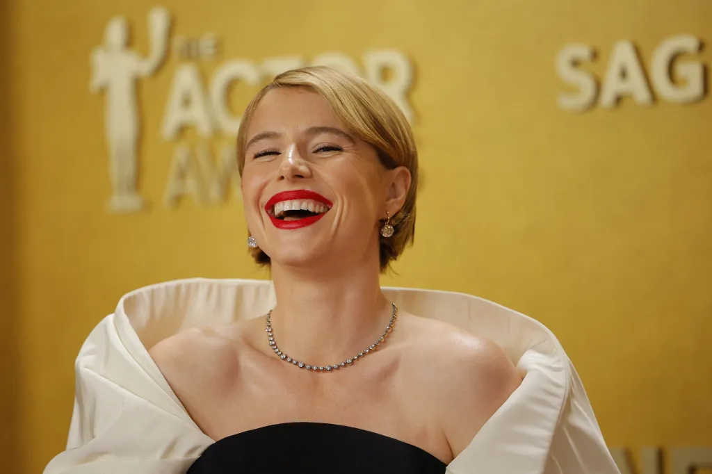 Jessie Buckley laughs on the red carpet at the Actor Awards.