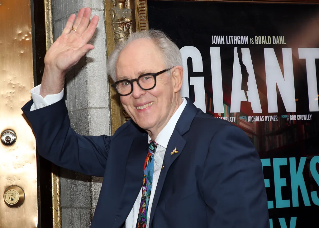 John Lithgow waves at the opening night of 