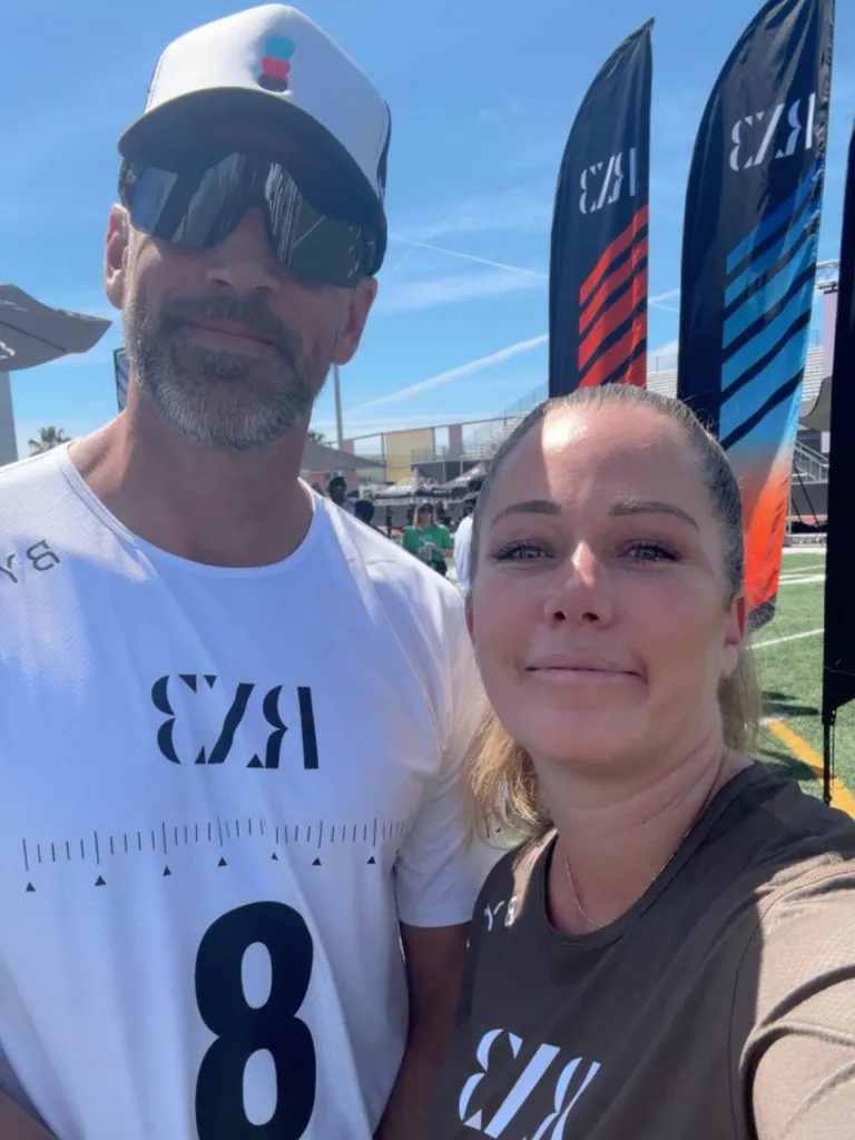Kendra Wilkinson and Aaron Rodgers posing for a selfie.