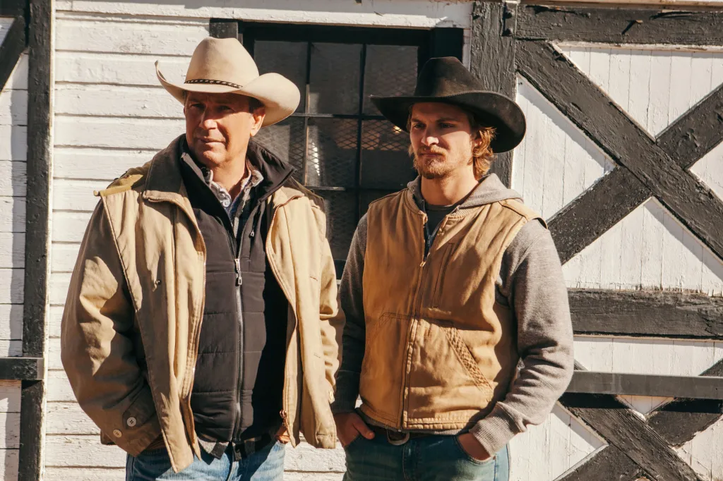 Kevin Costner as John Dutton and Luke Grimes as Kayce Dutton in Yellowstone.