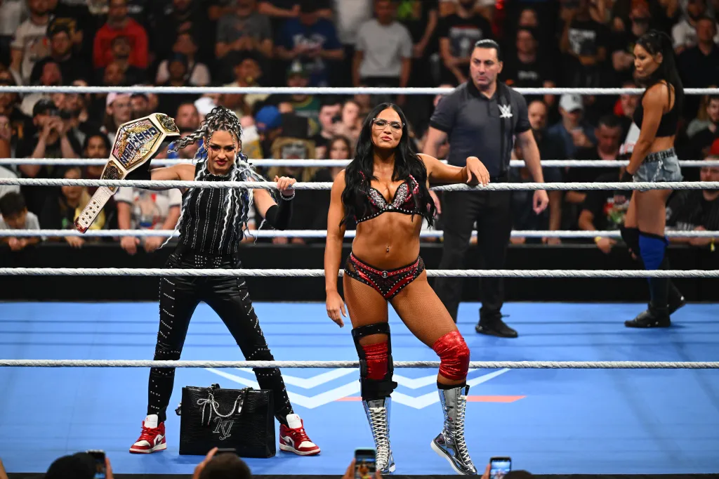 Kiana James and Giulia in a wrestling ring.