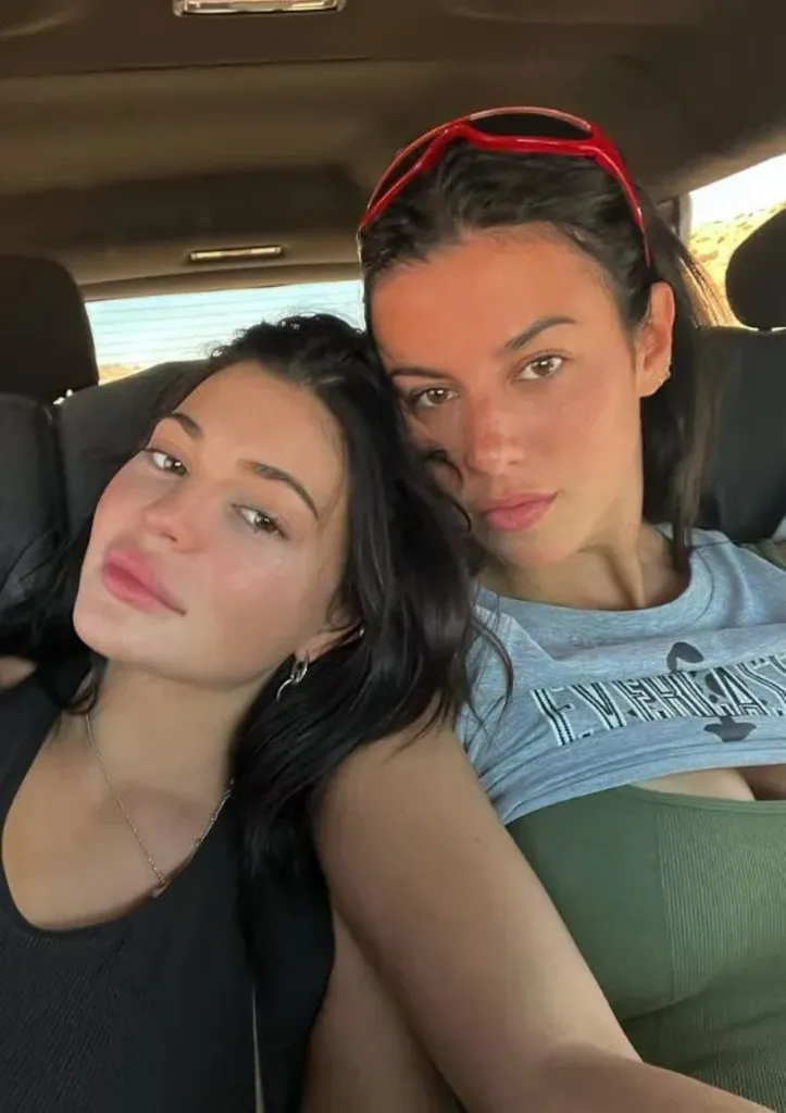 Kylie Jenner and Victoria Villarroel posing together in a car.