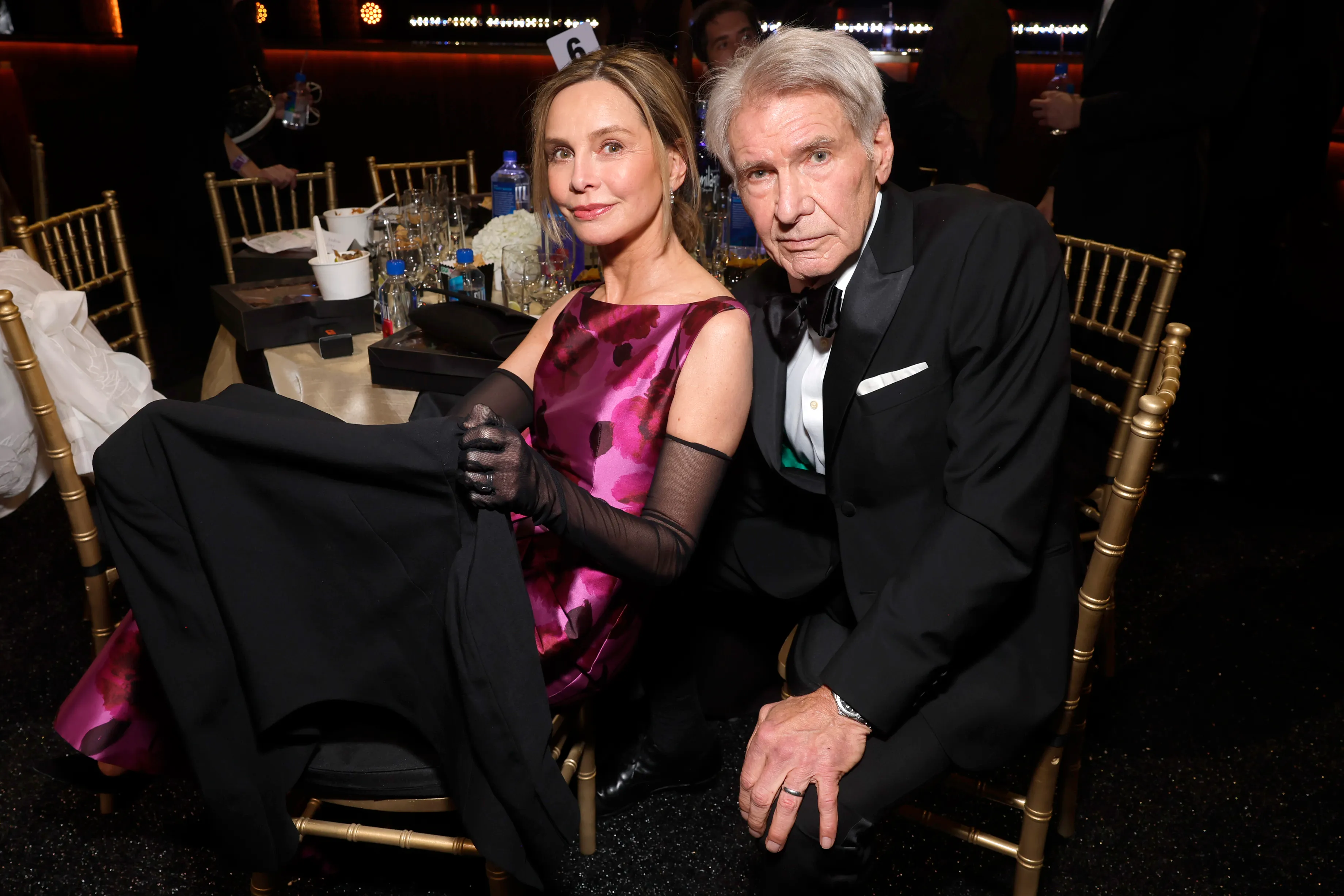 Calista Flockhart and Harrison Ford at a formal event.