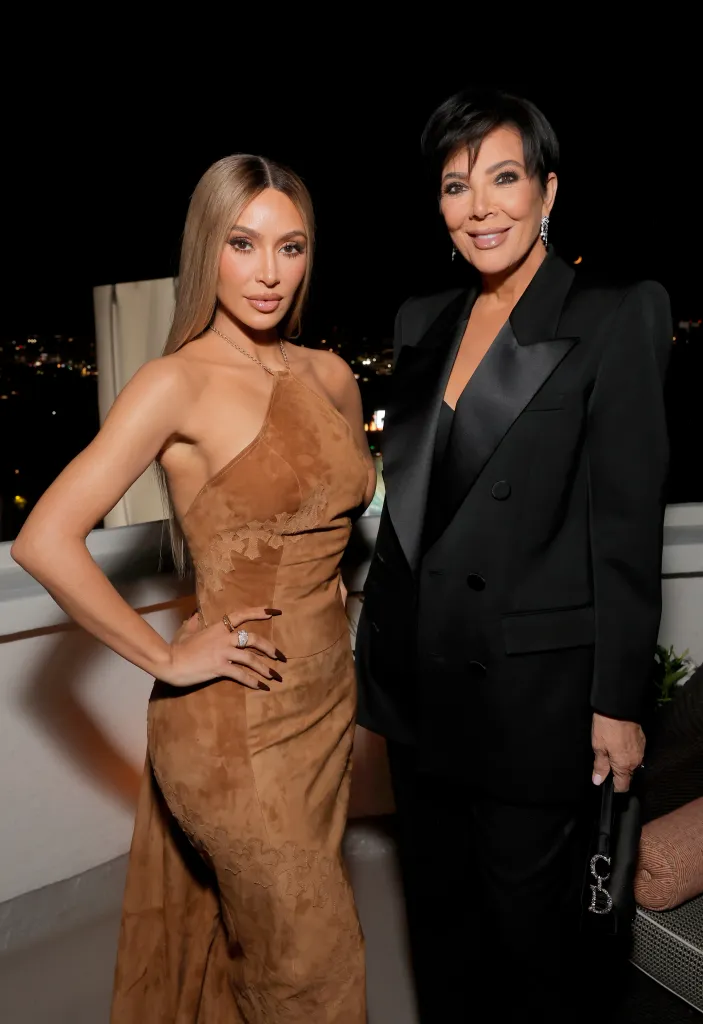 Kim Kardashian and Kris Jenner posing at an event.