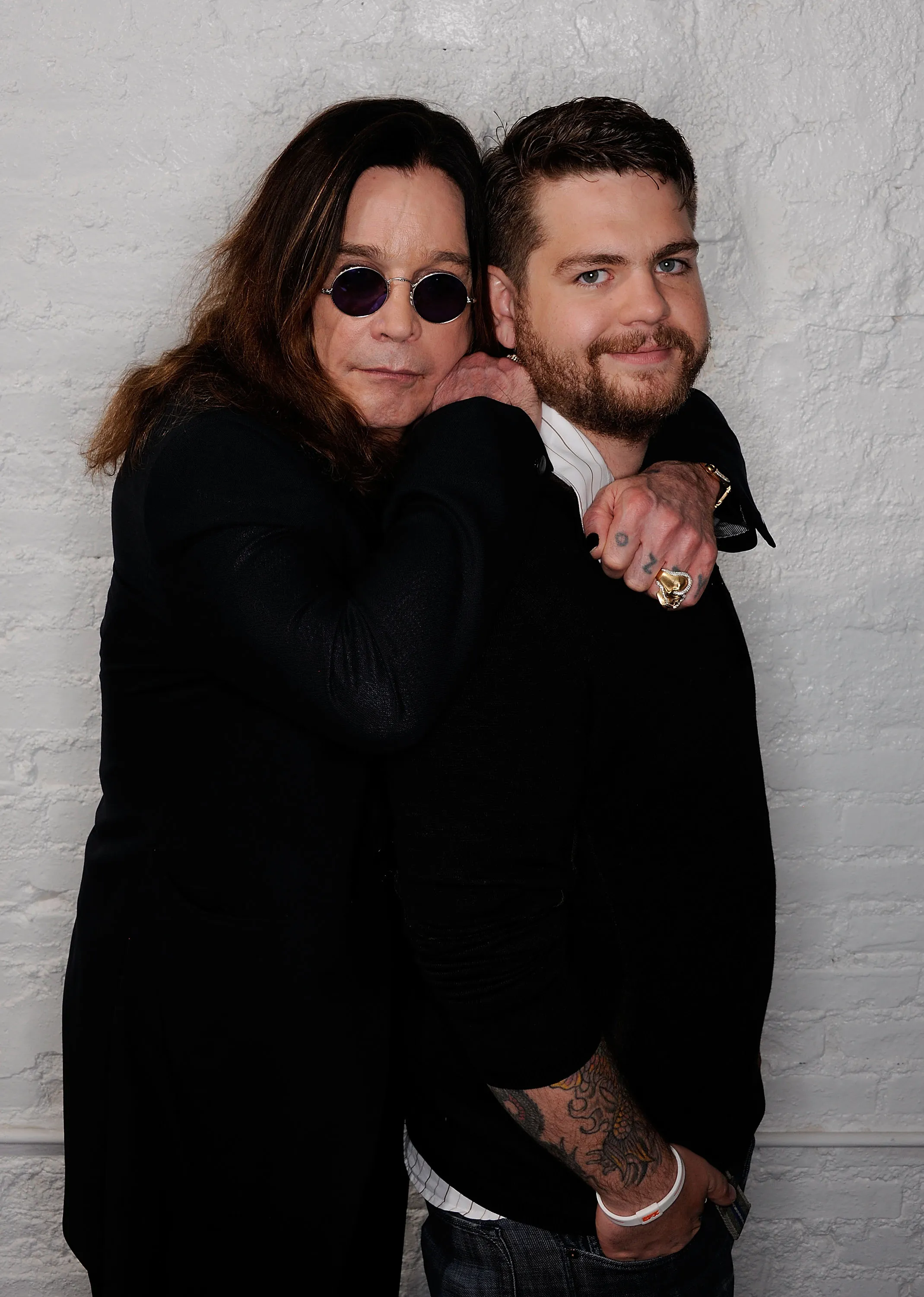 Ozzy Osbourne and his son Jack Osbourne posing for a portrait.