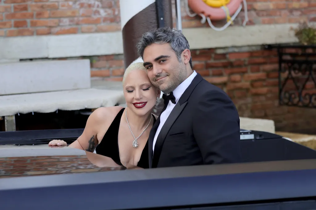 Lady Gaga and Michael Polansky embrace in a boat at the Venice International Film Festival.