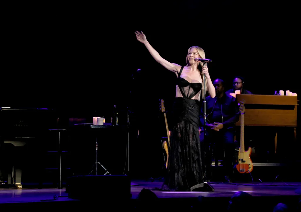 LeAnn Rimes performs in a black gown on stage during her