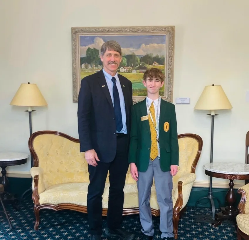 Legislative page Dean Roy poses with Vermont Lieutenant Governor John Rodgers.