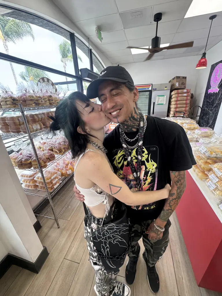 Lexi Bowman kissing Frank Eric Blackcloud II on the cheek.