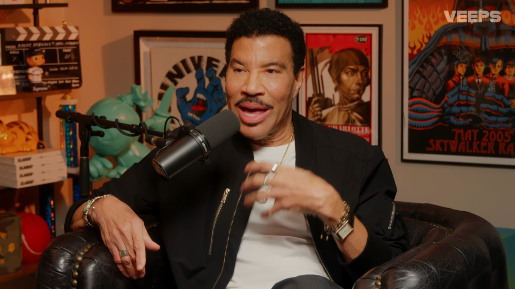Lionel Richie speaking into a microphone.