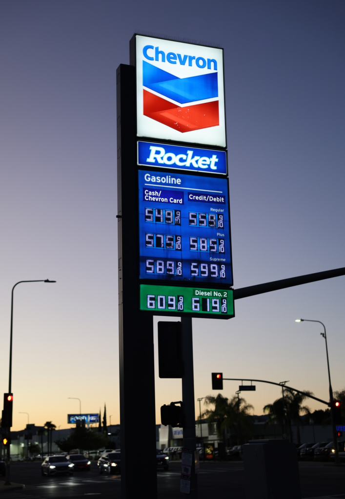 A Chevron gas station sign displaying surging gas prices in Los Angeles.
