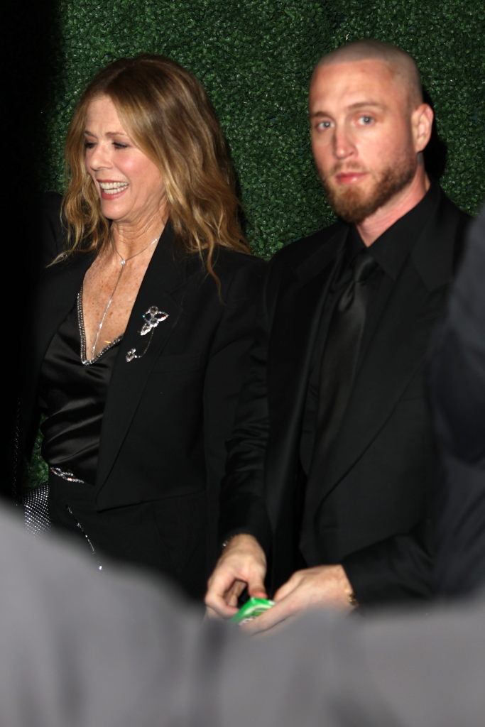 Rita Wilson and Chet Hanks leaving a pre-Oscars party.