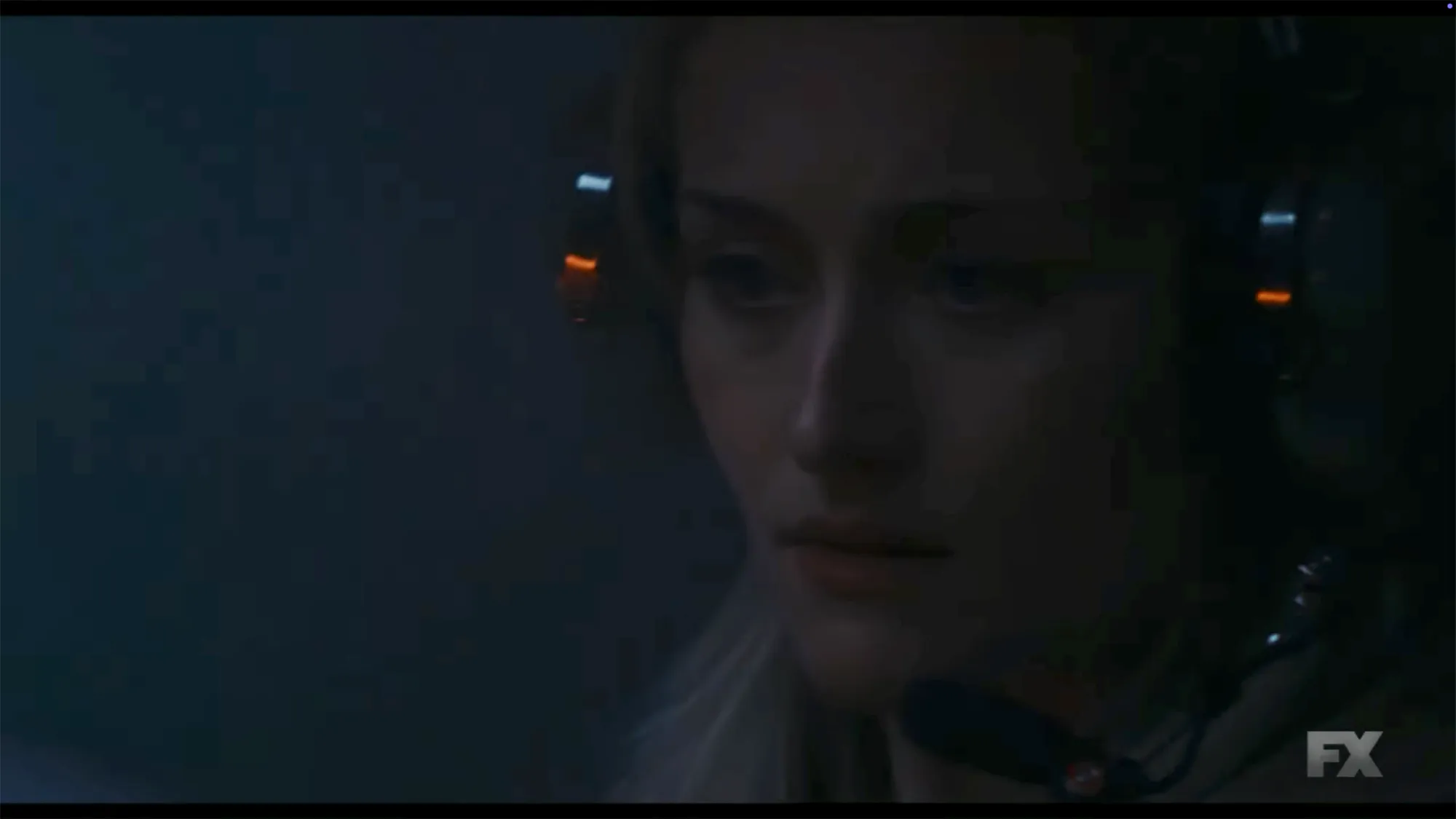 A woman wearing a headset with a microphone.