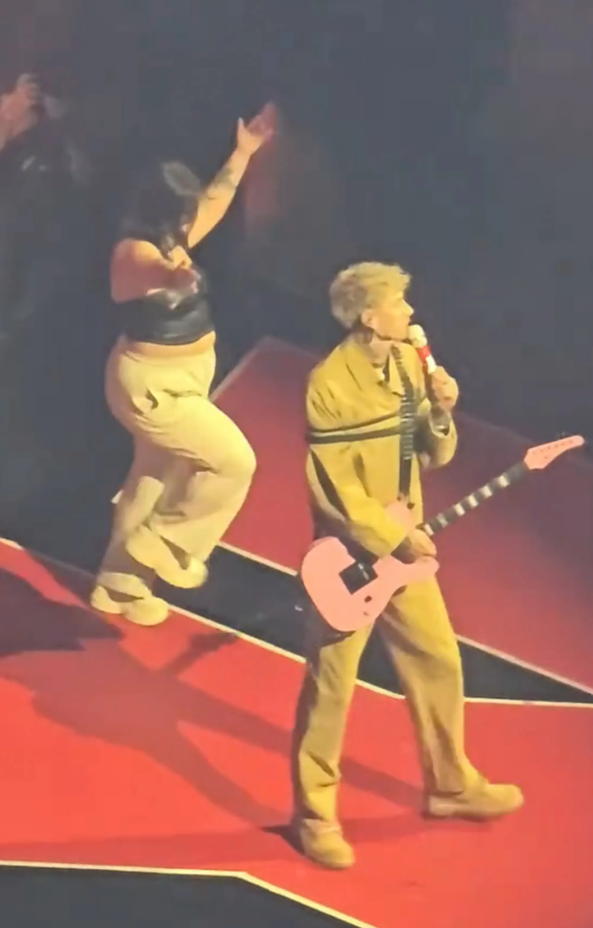 A fan was dancing and singing along but did not see the giant hole in the floor, as seen above.