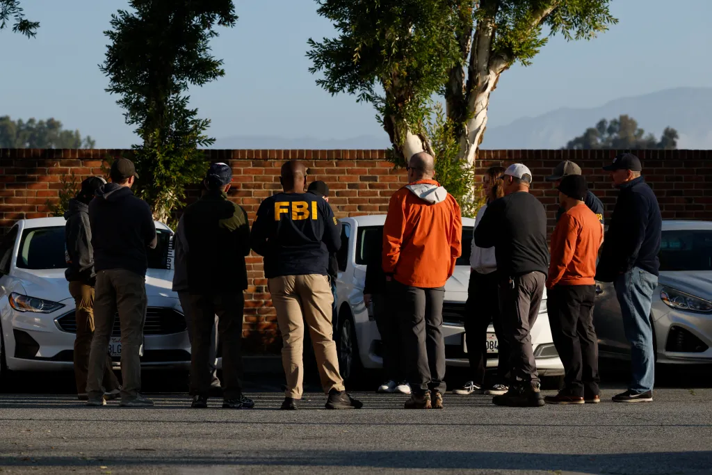 FBI task force members debriefing after serving a search warrant in East Los Angeles.