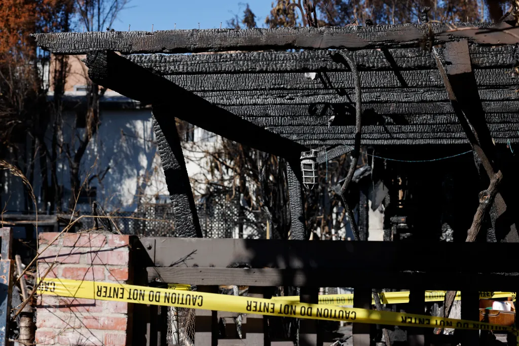 Burnt remains of the Galicia home with yellow 