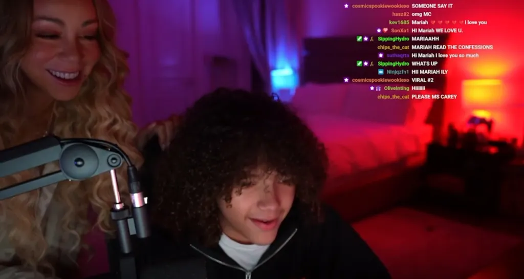 Mariah Carey appearing on her son's Twitch livestream, with chat messages expressing excitement.