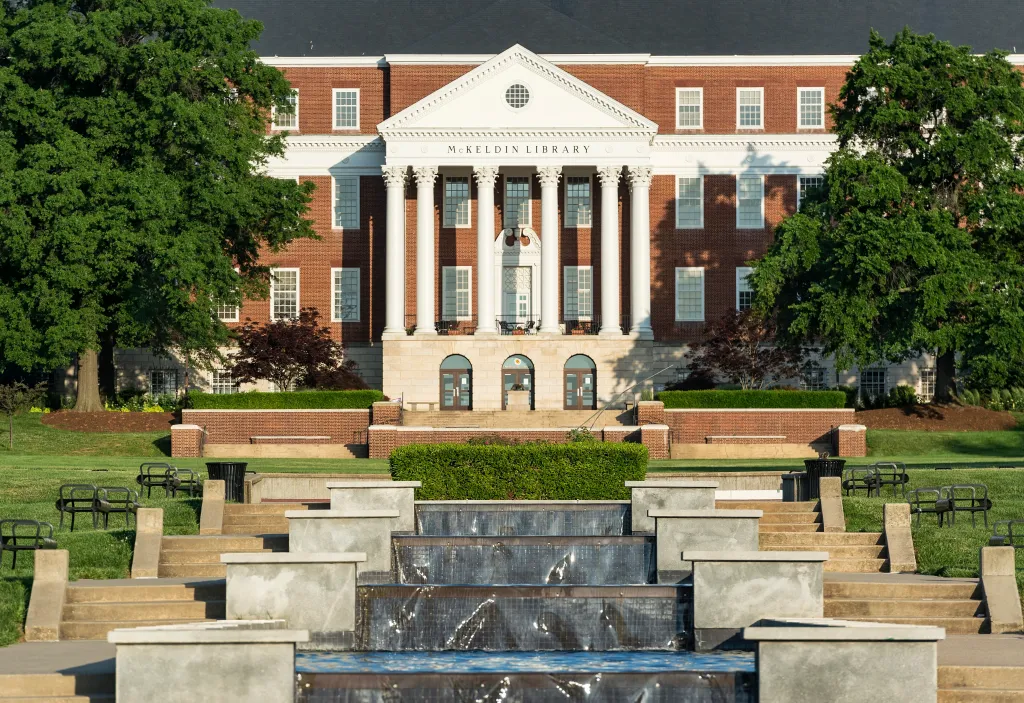 McKeldin Library, a brick building with white columns, and a terraced fountain on the campus of the University of Maryland.