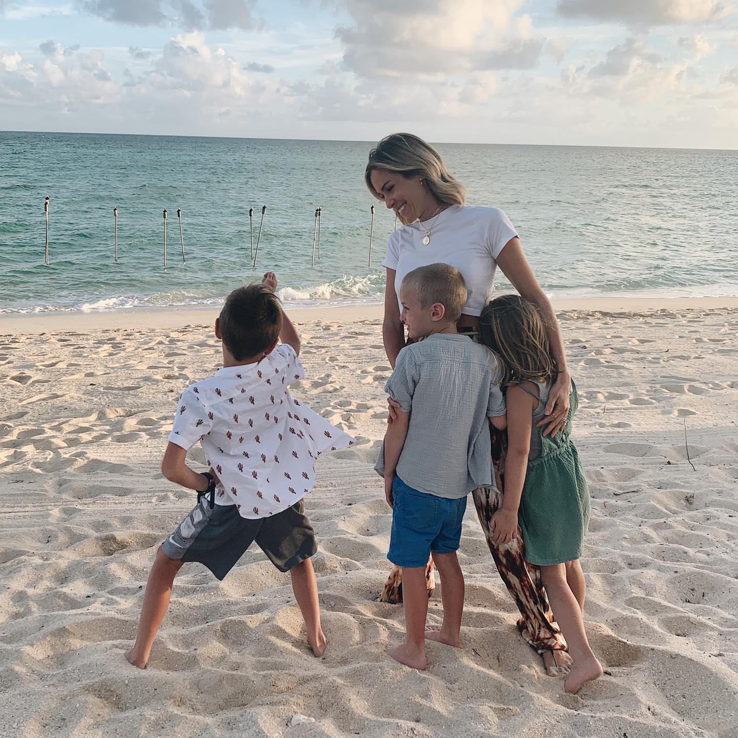 Kristin Cavallari with her three children on a beach.