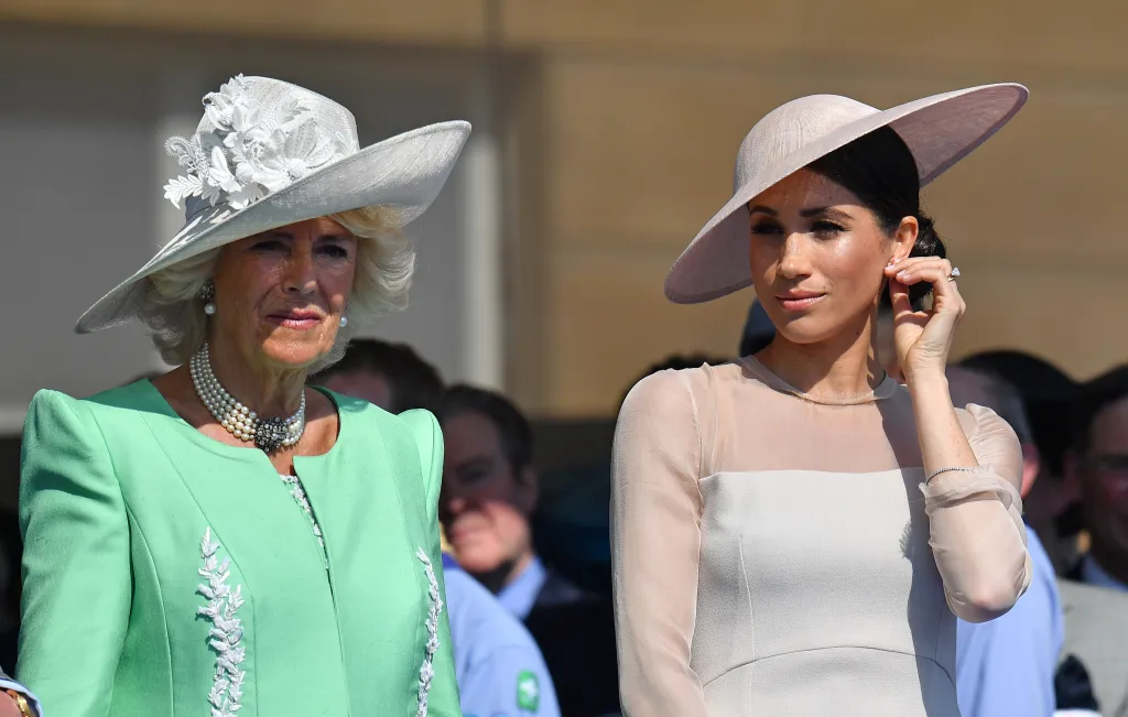 Meghan, Duchess of Sussex and Camilla, Duchess of Cornwall, attending a garden party at Buckingham Palace.