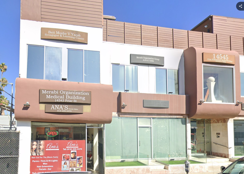 Exterior of Merabi Professional Medical Plaza, housing a synagogue, medical offices, and a beauty salon.