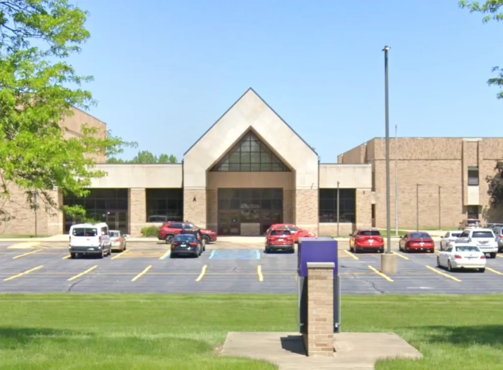 Merrillville Intermediate School building with a parking lot in front.