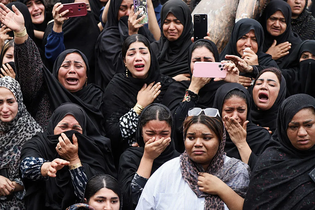 Mourners cry during a funeral for children killed in a reported strike on a primary school in Minab, Iran, on March 3, 2026.
