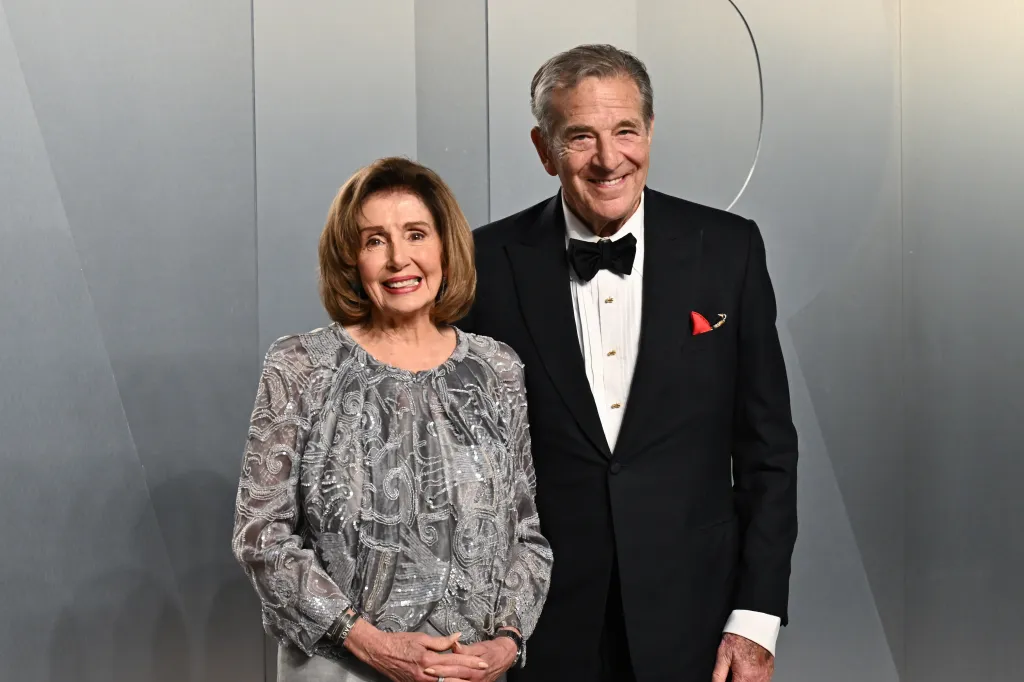 Nancy Pelosi and Paul Pelosi pose at the Vanity Fair Oscar Party.