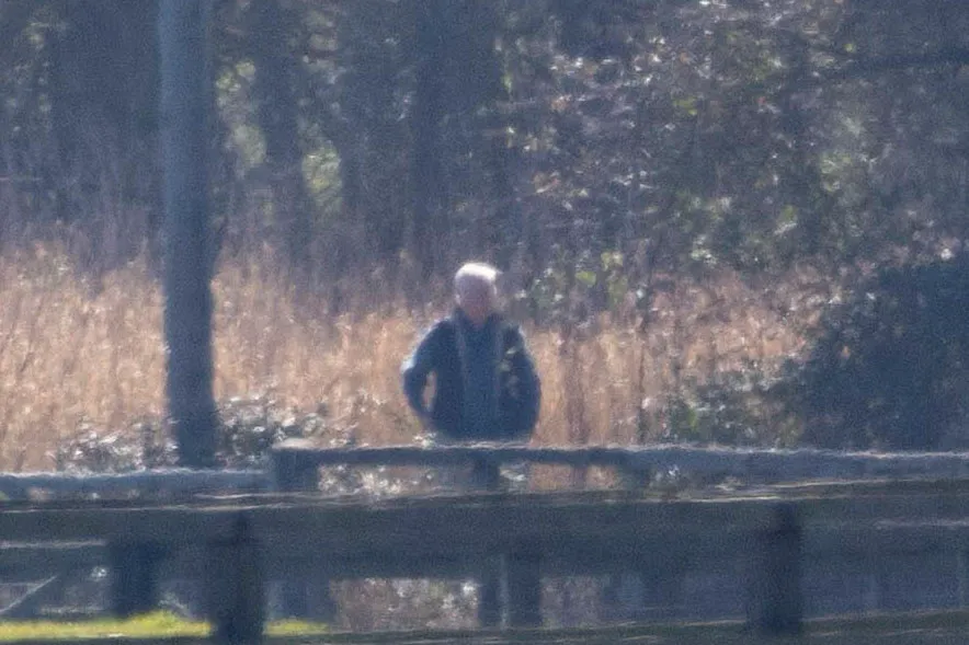 Andrew Mountbatten Windsor walking in a rural setting.