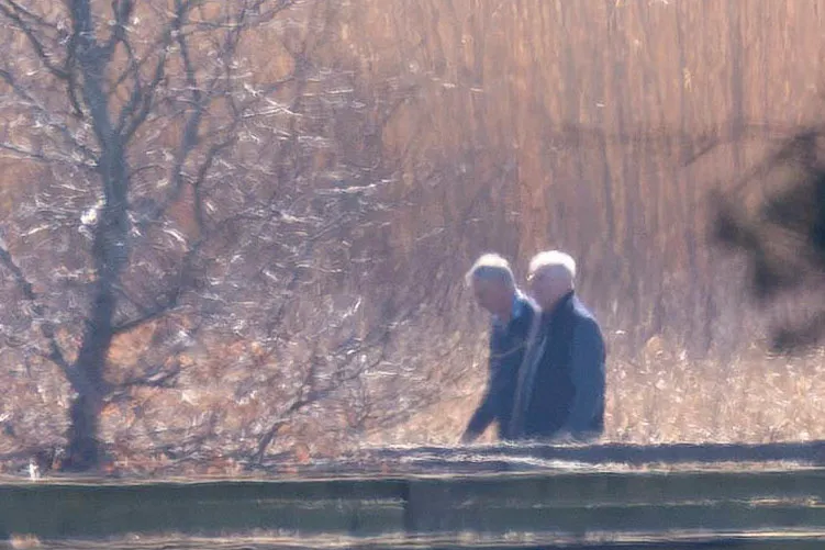 Andrew Mountbatten Windsor walking with a companion near Norfolk.