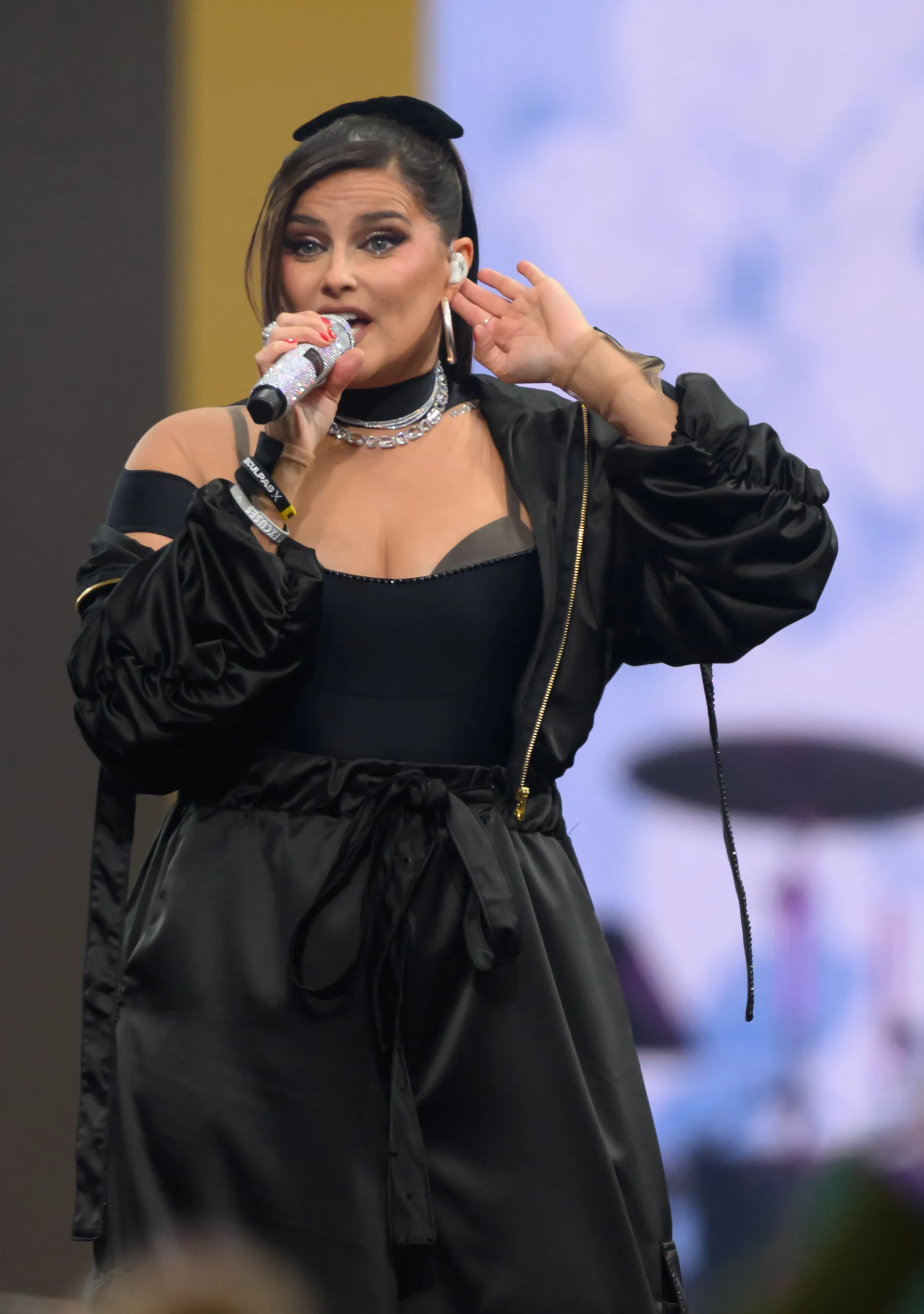 Nelly Furtado performing with a microphone at the Invictus Games opening ceremony.
