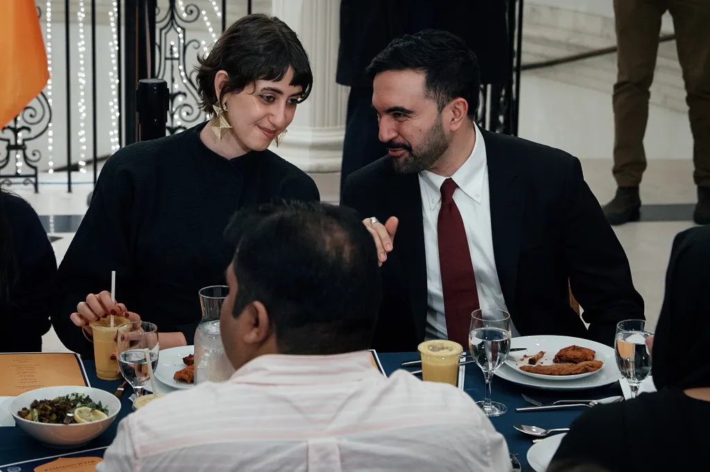 New York City Mayor Zohran Mamdani, right, speaks with his wife, Rama Duwaji, left, during a Ramadan iftar meal at the Museum of the City of New York on Thursday, March 12, 2026, in New York. 